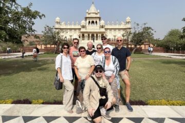 Foreign tourists taking photos in front of Amer Fort during Jaipur Same Day Tour