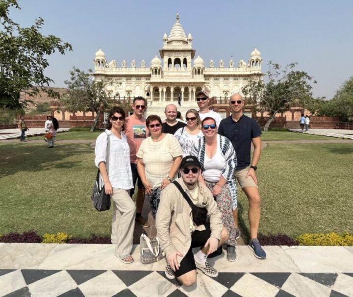 Foreign tourists taking photos in front of Amer Fort during Jaipur Same Day Tour
