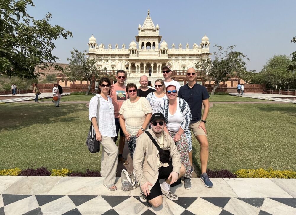 Foreign tourists taking photos in front of Amer Fort during Jaipur Same Day Tour