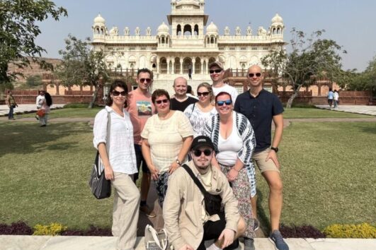 Foreign tourists taking photos in front of Amer Fort during Jaipur Same Day Tour