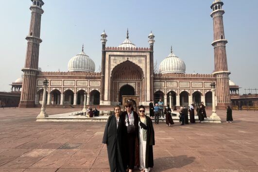 Tourists standing at Jama Masjid during 2 Days Delhi Tour Package