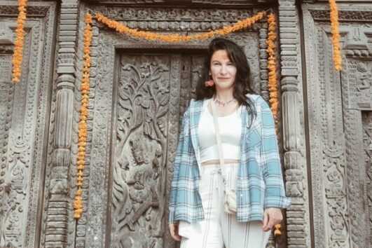 Foreigner woman at Khajuraho temple during Golden Triangle with Khajuraho and Varanasi tour India