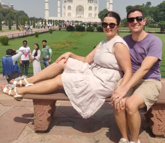 Couple sitting together at Taj Mahal during romantic Taj Mahal tour in Agra India